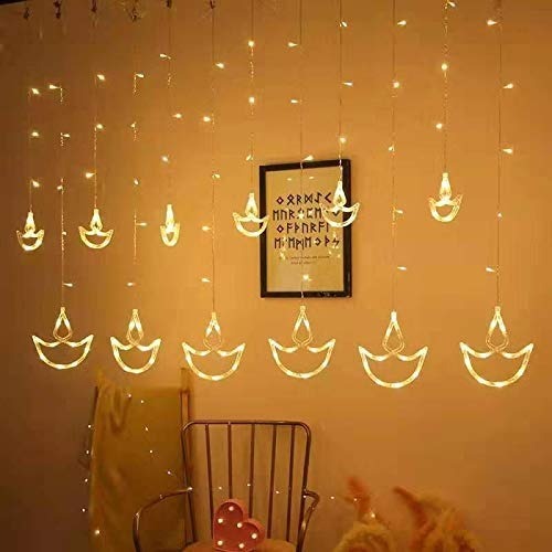 Warm White Diya/Diwali Light Curtain, Led String Copper Lights with Pack of 12 Hanging Diyas, 8 Flashing Modes, Decoration, Prong Base, 2.5 Meters